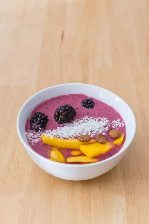 Acai Bowl with Mango, Almonds and desiccated coconut