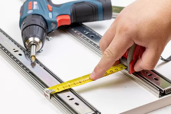Acu drill with hand measuring in the workshop