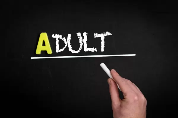 Adult text on blackboard