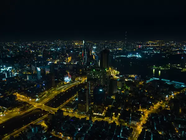 Aerial Drone Photo of several Districts of Ho Chi Minh City, Vietnam with Skyscrapers such as Bitexco Financial Tower and Landmark 81