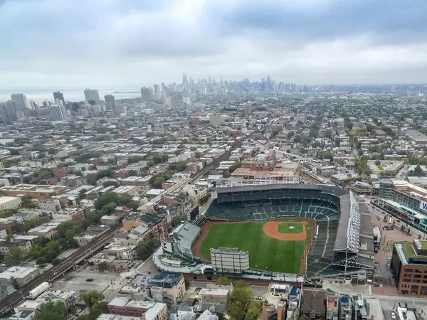 Aerial of Wrigley Field stadium with Chicago skyline in the background