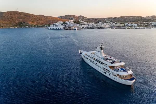 Aerial photo: luxury motor yacht Astarte II built by Blohm & Voss, headed to Adamantas port, Milos