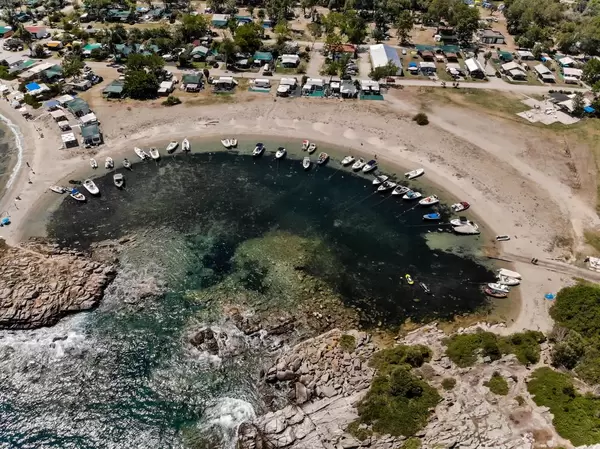 Aerial photo of a small, natural boat harbour