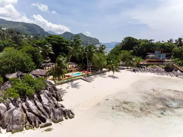 Aerial photography of the villas at Seychelles Island L’Islette - Shooting location for Russian Reality TV Show "Dom 2" with beach and ocean view