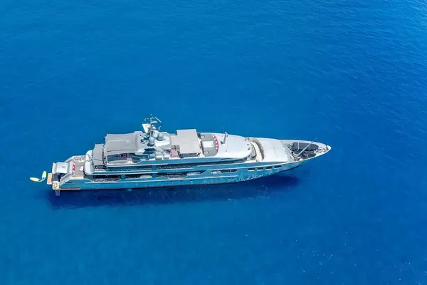 Aerial picture of a mega yacht in the blue waters of the south Aegean off the coast of Milos, Greece