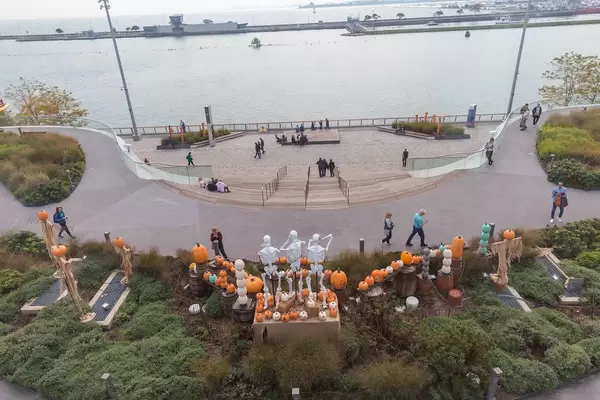 Aerial picture of people at Navy Pier sea bridge, decorated with skeletons and pumpkins for Halloween season