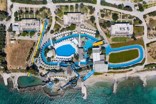 Aerial picture of the Aqua Paros Water Park on a greek Island, with pool and waterslides at the Mediterranean Sea