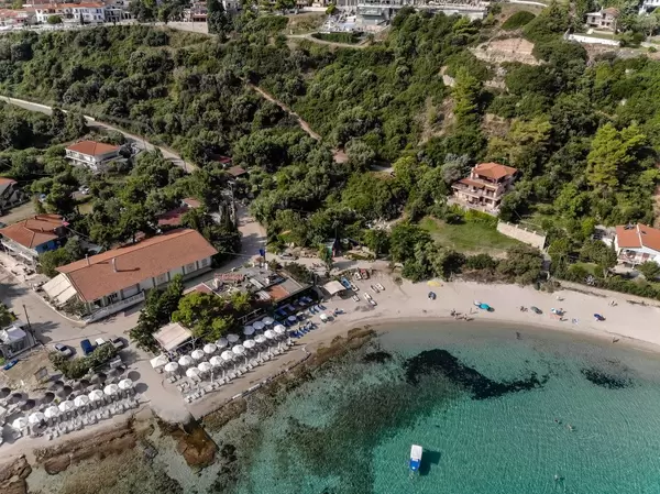Aerial shot of the beach and surroundings in Afitos, Greece