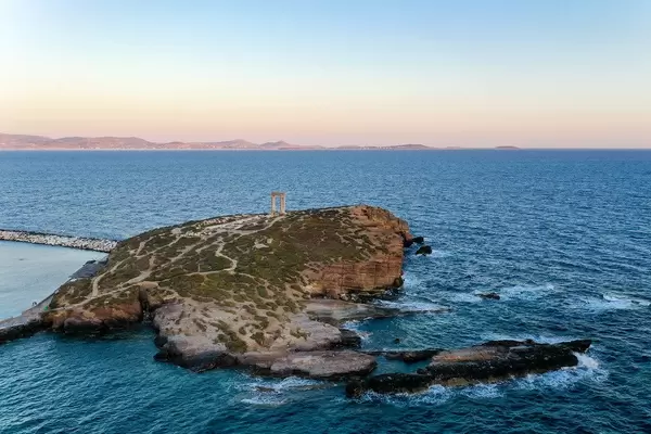 Aerial shot: the islet of Palátia, at the entrance to Naxos harbour, with the Portara, symbol of the island