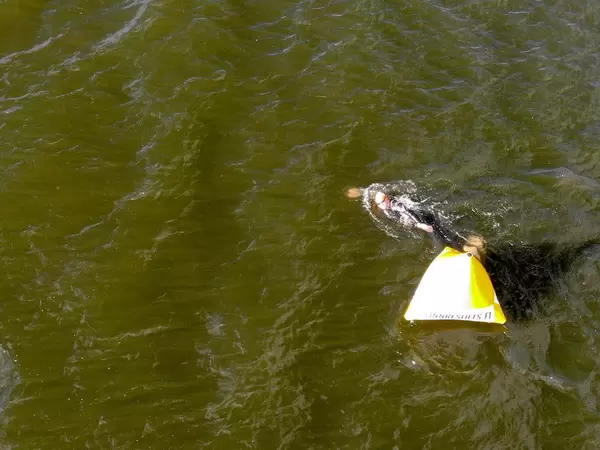 Aerial view of an Ironman triathlete swimming around a buoy in Lake Vesijärvi at Lahti, Finland