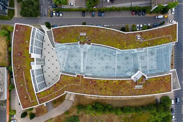 Aerial view of the Federal Administration Office "Bundesverwaltungsamt" Cologne, Germany, with large glass roof and greened flat roof
