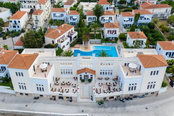 Aerial view of the imposing facade of the greek Hotel Nissia Traditional Residences, with a private Pool, near Dapia on Spetses