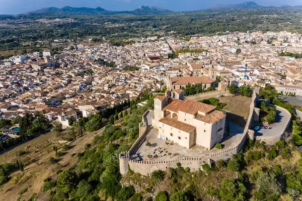 Aerial view of the medieval fortress and sanctuary of Sant Salvador overlooking the town of Artà, Majorca