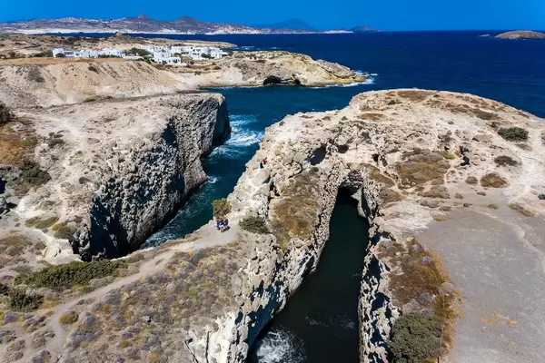 Aerial view of the spectacular cliffs and narrow bays of Papafrangas and the holiday houses of Pachena