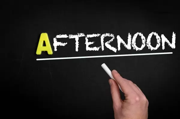 Afternoon text on blackboard