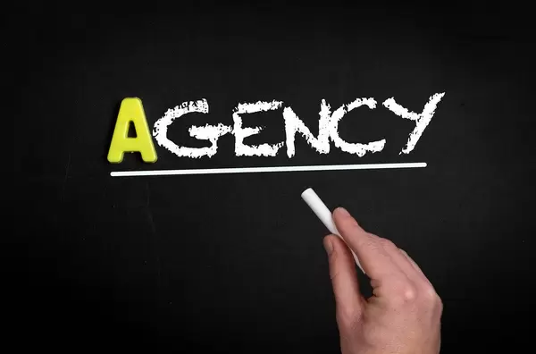 Agency text on blackboard