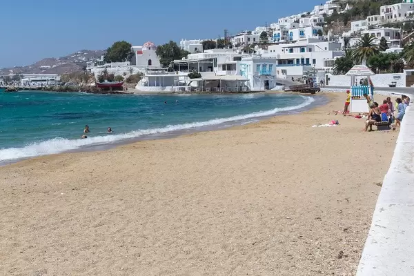 Agia Anna beach in Chora, main town of Mykonos, with few people swimming and no beach umbrellas