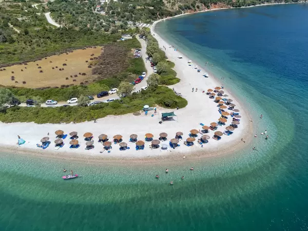 Agios Dimitrios beach on Alonissos with its characteristic horseshoe shape and turquoise-blue waters
