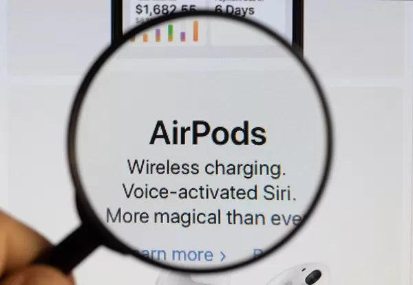 AirPods text under magnifying glass