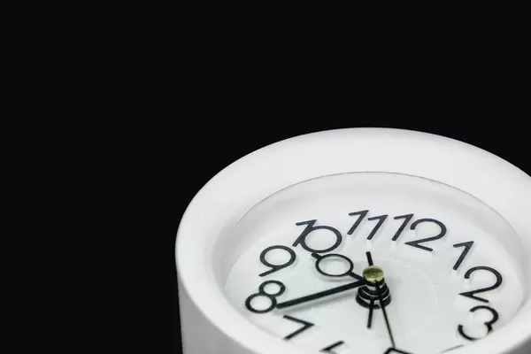 Alarm clock on corner frame