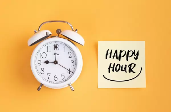 Alarm clock with handwritten text Happy Hour