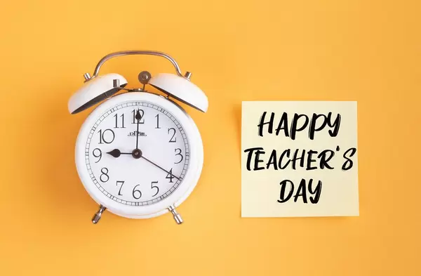 Alarm clock with handwritten text Happy Teacher's Day