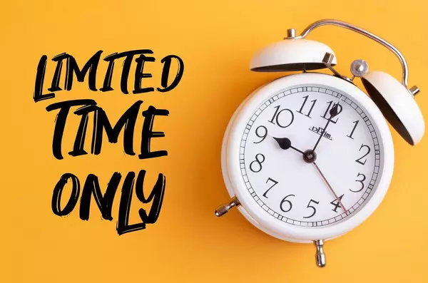 Alarm clock with handwritten text Limited Time Only on yellow background