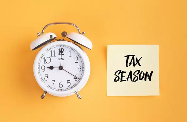 Alarm clock with handwritten text Tax Season