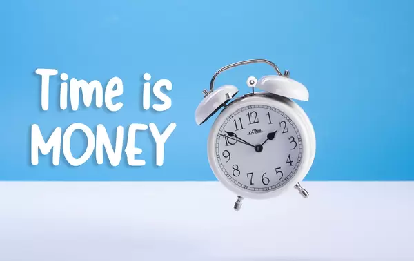 Alarm clock with Time is Money text