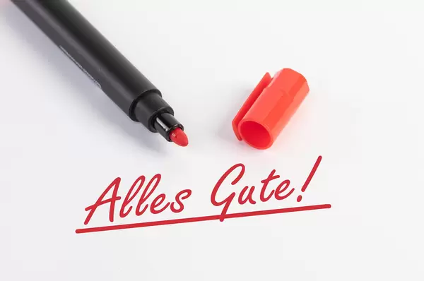 Alles Gute! text with red marker pen