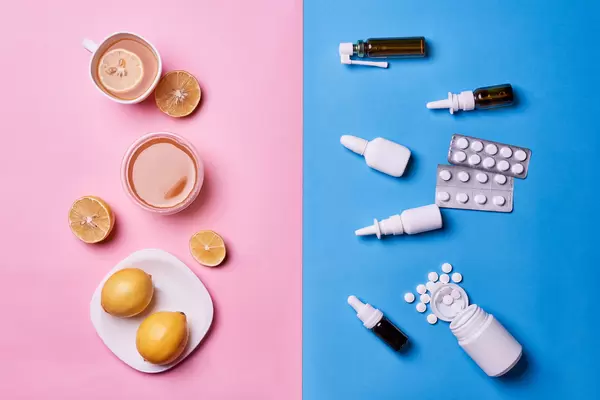 Alternative remedies and traditional pills to treat colds and flu. Natural medicine vs conventional medicine concept