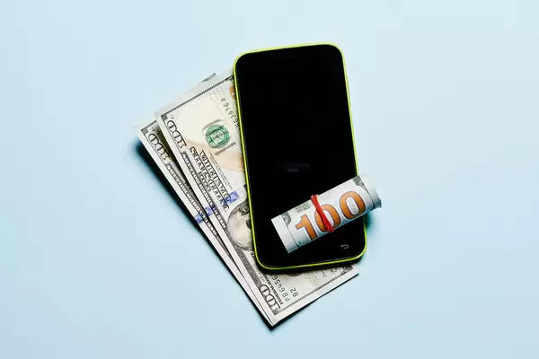 American dollars and smartphone - Mobile payments concept