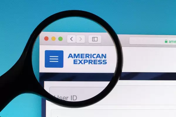American Express logo under magnifying glass