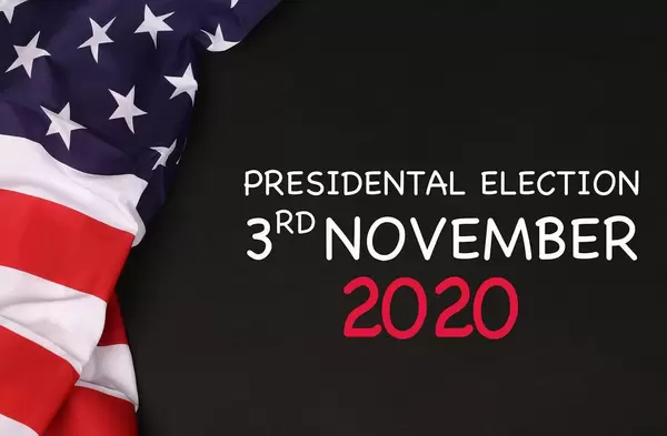 American flag with President election date against a blackboard background