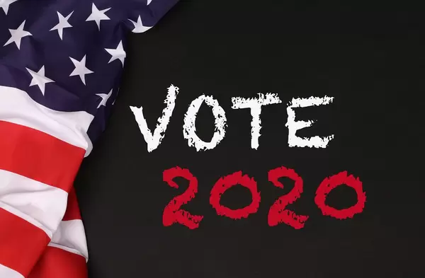 American flag with the text Vote 2020 against a blackboard background.jpg