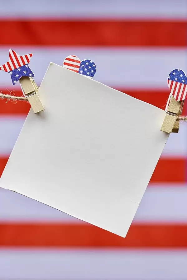 An empty card hanging over the American flag on the background
