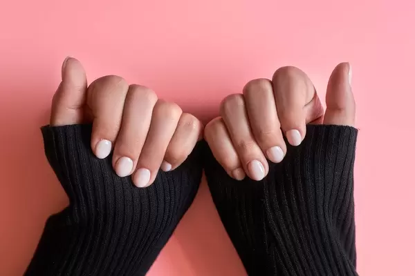 An unrecognizable female showing her hands with beautiful nail manicure (Flip 2020)