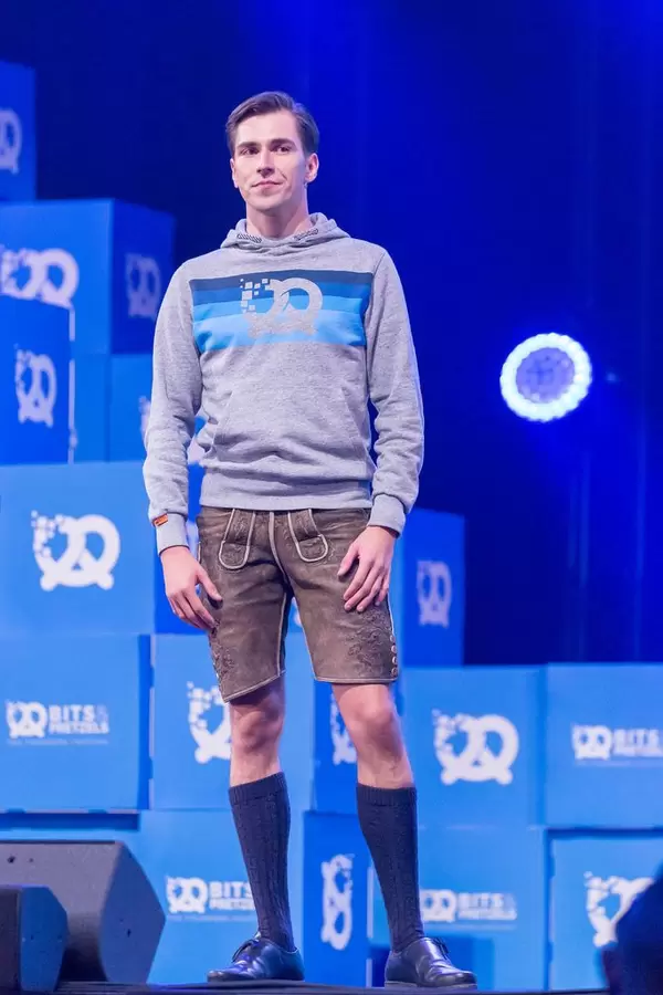 Andreas Bruckschlögl in bavarian leatherpants on the stage as Speaker at the Bits & Pretzels Festival in München