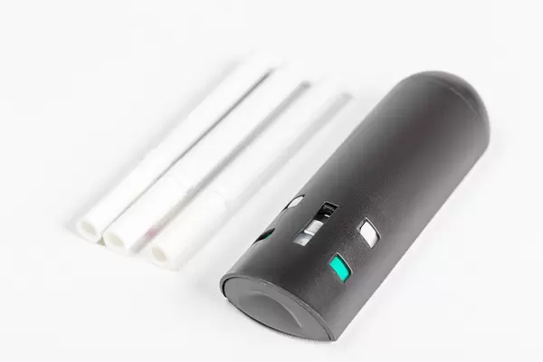 Anti-smoking spray and cigarettes on a white background