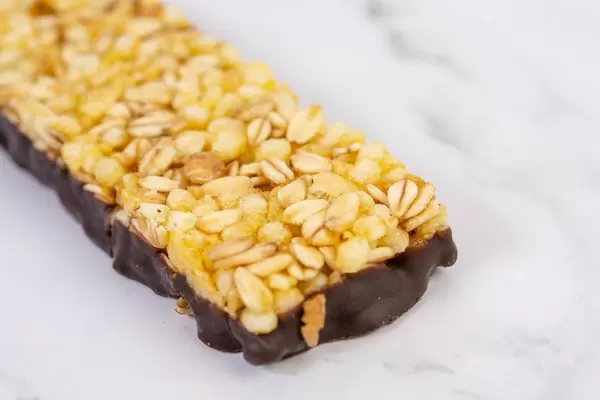 Antioxidant Cereal Bar with Orange on the kitchen table (Flip 2019)