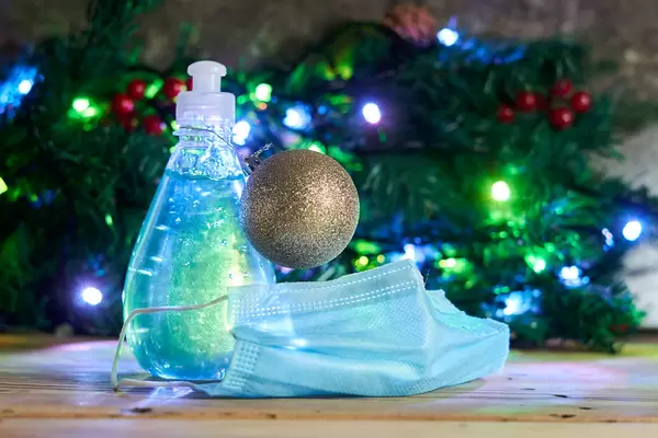 Antiseptic disinfectant gel, medical face mask and Christmas decorations