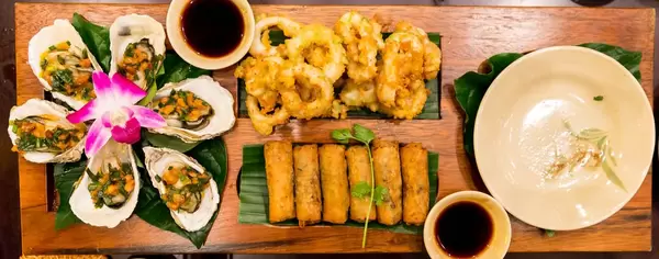 Apetizers in Vietnam: Spring Rolls and Oysters