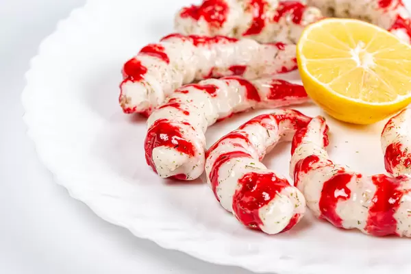 Appetizer of prawns marinated in a spicy sauce