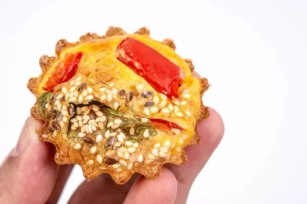 Appetizers with paprika radishes and spinach in the hand