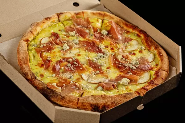 Appetizing pizza with pears and cheese Dorblu