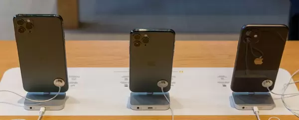 Apple iPhone 11, iPhone 11 Pro and iPhone 11 Pro Max seen from behind, on display at the Apple Michigan Avenue Store in Chicago