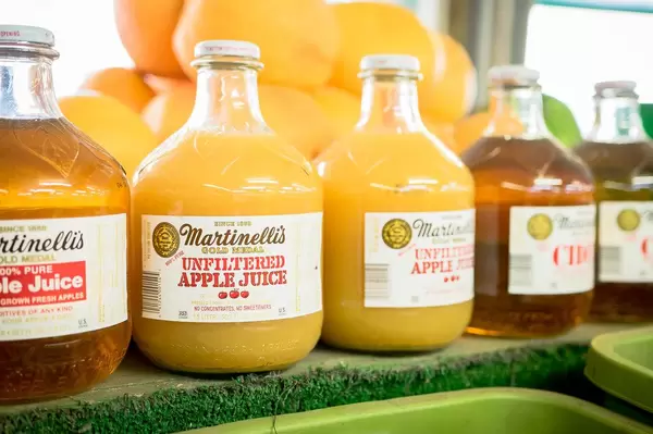 Apple juice glass bottles in market
