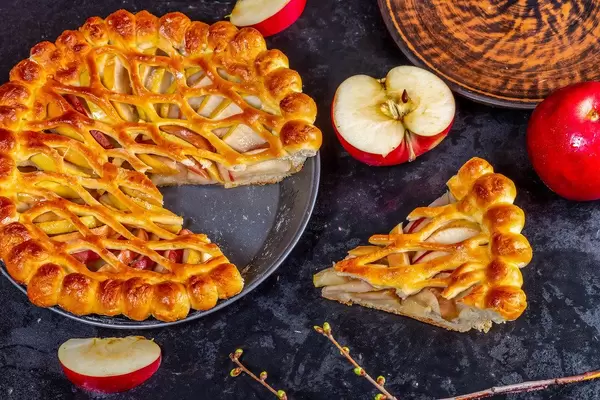 Apple pie-Charlotte with fresh apples on a black background (Flip 2019)