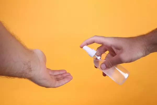 Applying sanitizer gel