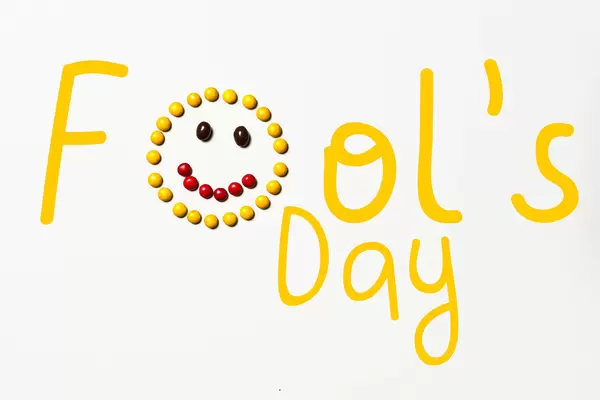 April Fools' Day text made with sweet candies on white background